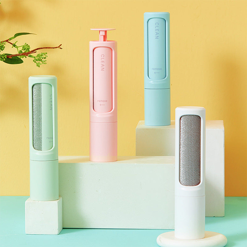Four Furlo FreshSpace reusable pet hair remover brushes in green, pink, blue and white