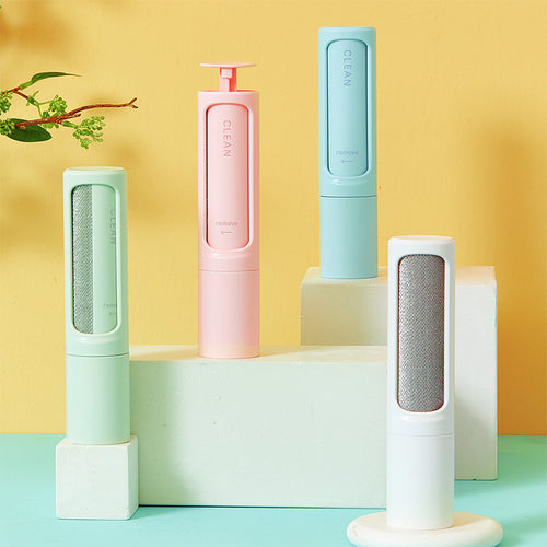 Four Furlo FreshSpace reusable pet hair remover brushes in green, pink, blue and white